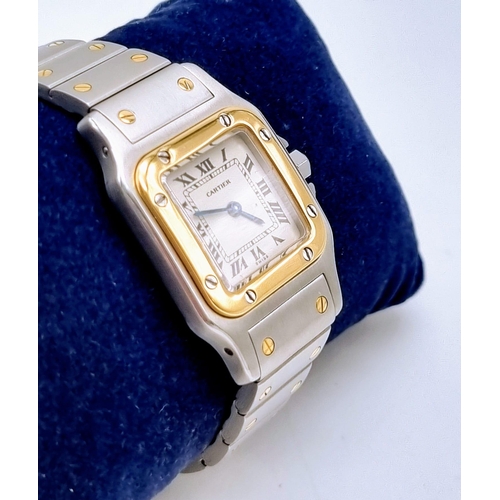 167 - A LADIES GOLD AND STEEL CARTIER WRISTWATCH WITH QUARTZ MOVEMENT. 24mm