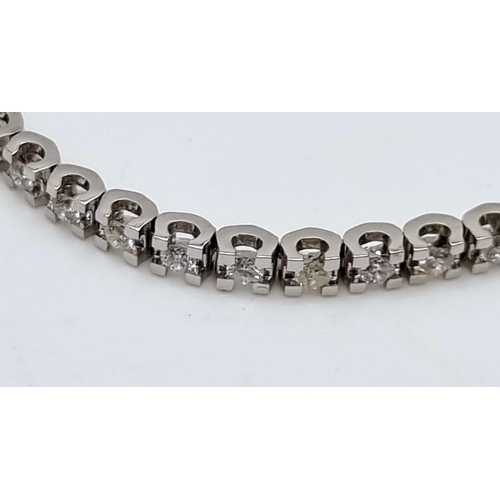 114 - 18k White Gold Tennis Bracelet With 54 Brilliant Round Cut Diamonds. Total 2.23ct. Length 18cm. Tota... 