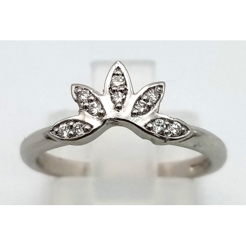 169 - An 18 K white gold ring with diamonds set in a fancy design. Ring size: J1/2, weight: 3.7 g.