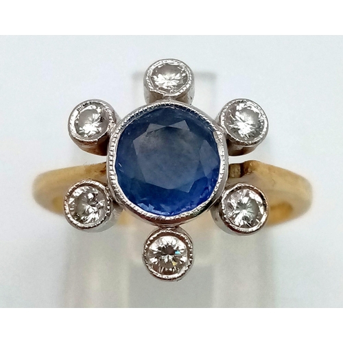 297 - An 18 K yellow gold ring with a blue, oval cut sapphire, surrounded by six brilliant cut diamonds.  ... 