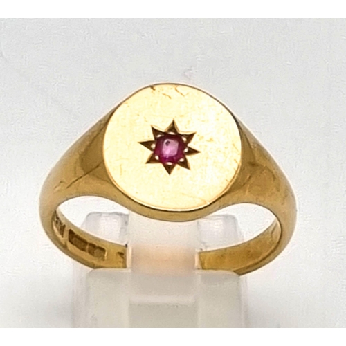 30 - A 9K Yellow Gold Ruby Solitaire Signet Gents Ring. Size V. 6.21g total weight,