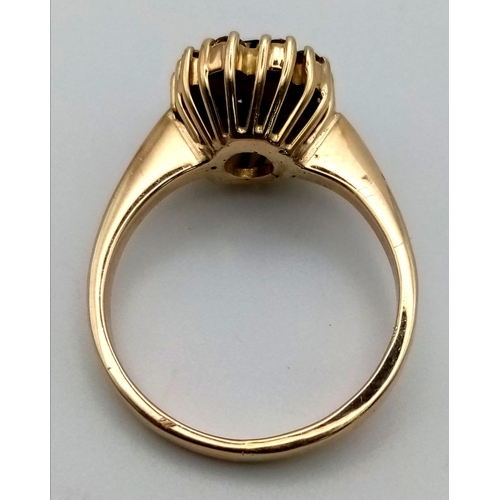 76 - A 14 k yellow gold ring with an oval cut sapphire surrounded by a halo of diamonds (0.5 carats). Rin... 