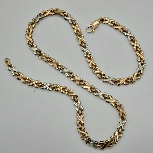 11 - A 9k Three-Coloured Gold Bow-Link Necklace. 40cm. 12.38g