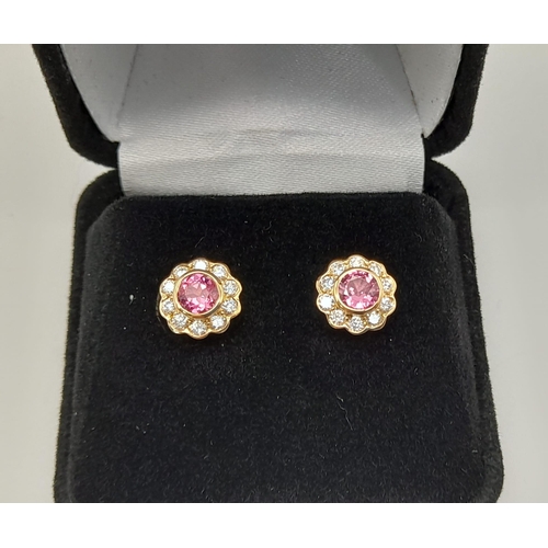 235 - A pair of 18k bi-colour natural pink spinel earrings. 0.66ct of Tanzanian spinel with unheated treat... 