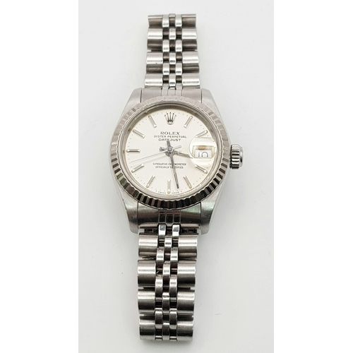 264 - A Rolex Oyster Perpetual Datejust Ladies Watch. Stainless steel strap and case - 26mm. Silver tone d... 