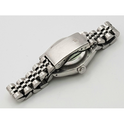 264 - A Rolex Oyster Perpetual Datejust Ladies Watch. Stainless steel strap and case - 26mm. Silver tone d... 