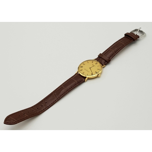 335 - A Vintage Chopard 18K Gold Cased Gents Watch. Brown leather strap. 18K gold case - 33mm.  Gold tone ... 