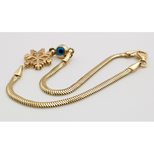 339 - A 14 K yellow gold, snake chain bracelet with a stone set snowflake and an evil eye. Length: 18 cm, ... 