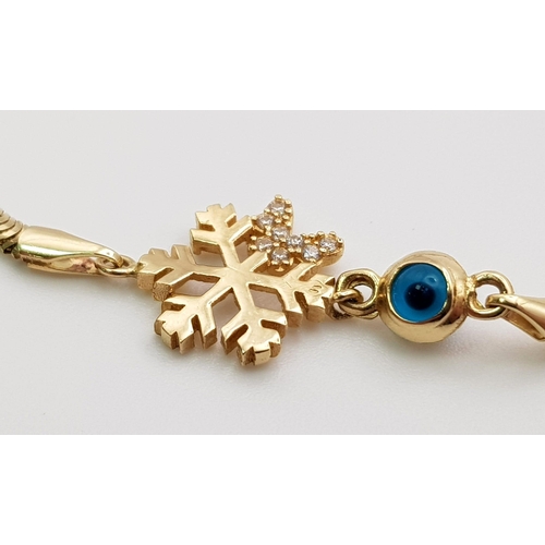 339 - A 14 K yellow gold, snake chain bracelet with a stone set snowflake and an evil eye. Length: 18 cm, ... 