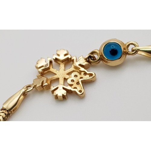 339 - A 14 K yellow gold, snake chain bracelet with a stone set snowflake and an evil eye. Length: 18 cm, ... 