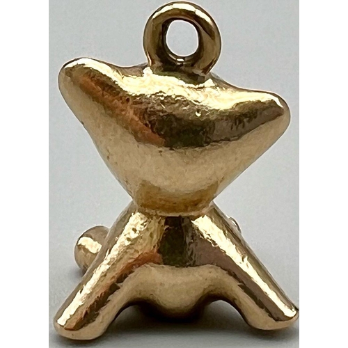 369 - A mid century stylised 9k yellow gold charm in the form of a teddy bear by Hans Georg Maunter. It is... 