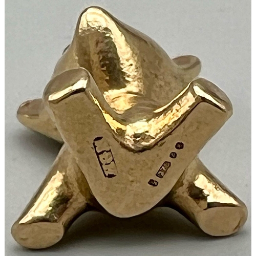 369 - A mid century stylised 9k yellow gold charm in the form of a teddy bear by Hans Georg Maunter. It is... 