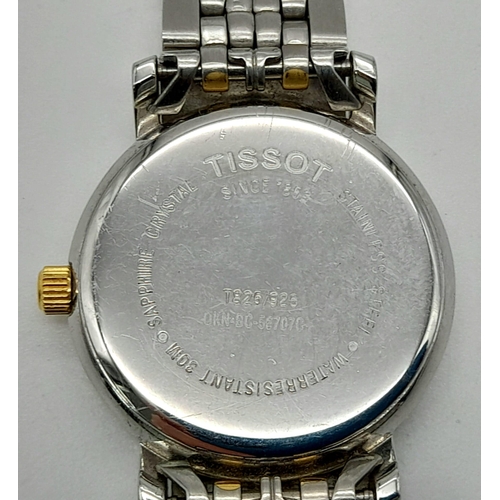 430 - A Tissot Two-Tone Ladies Quartz Watch. Gilded and stainless steel strap and case - 23mm. White dial ... 