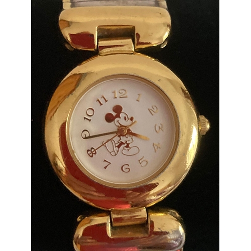 371 - Vintage MICKEY MOUSE wristwatch in gold tone, having white face with golden numbers and hands. Expan... 