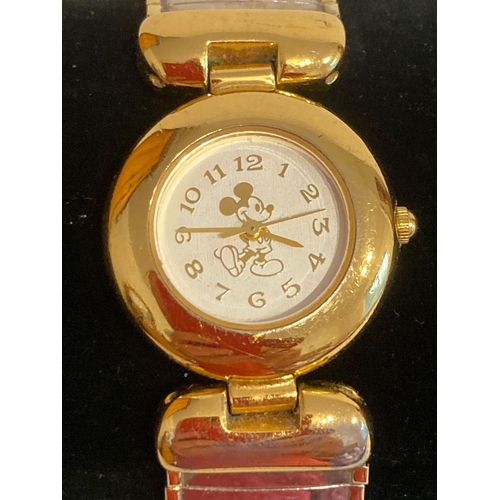 371 - Vintage MICKEY MOUSE wristwatch in gold tone, having white face with golden numbers and hands. Expan... 