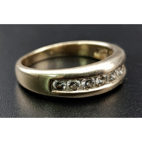 397 - A 9 K yellow gold ring with a band of diamonds (0.35 carats) Ring size: P, weight: 4.5 g.