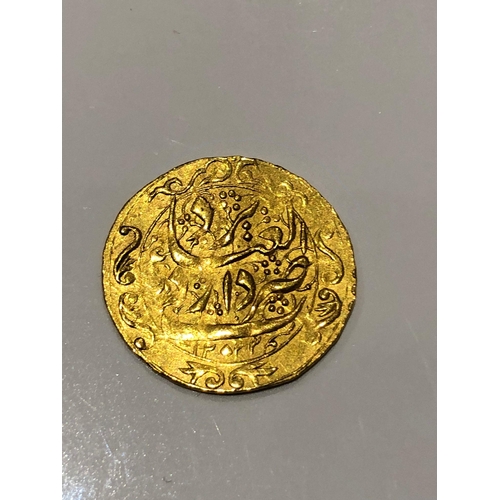 283 - A antique extremely rare Islamic Persian high karat gold coin 
Possibly very rare 

Comes with prote... 