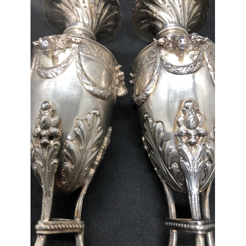 290 - Magnificent 19th century solid silver pair of urn vases 
London import 1906 

Both vases hold clear ... 