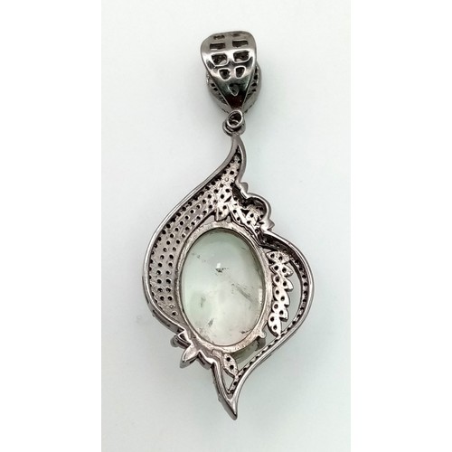 394 - Intricately designed Green Amethyst Pendant adorned with Rose cut diamonds. Green Amethyst - 16.45ct... 