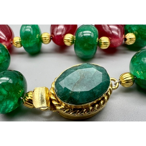 112 - A spectacular necklace with large, round emerald cabochons, large pear shaped ruby cabochons, and a ... 