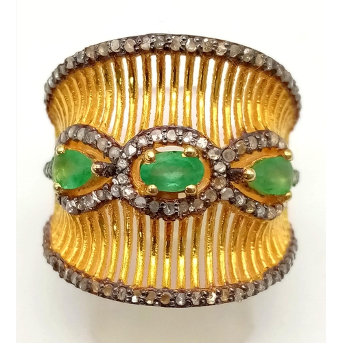 126 - A very unusual, gold and silver ring with 3 Colombian emeralds and over 150 diamonds (tested) on par... 