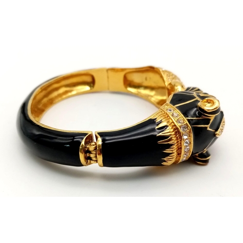 154 - A fabulous black panther, enamel and gold filled bangle with cubic zirconia and synthetic emerald ey... 