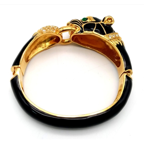 154 - A fabulous black panther, enamel and gold filled bangle with cubic zirconia and synthetic emerald ey... 