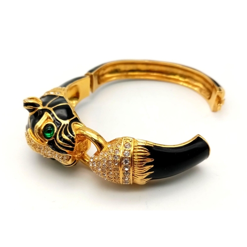 154 - A fabulous black panther, enamel and gold filled bangle with cubic zirconia and synthetic emerald ey... 