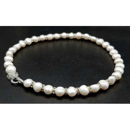 161 - A very elegant, natural, cultured, white pearl and cubic zirconia necklace and bracelet set with pan... 