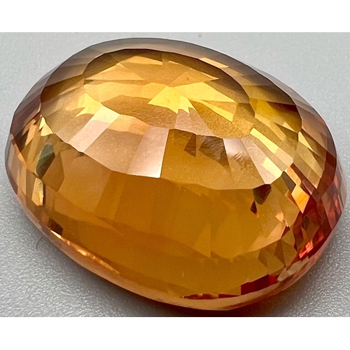 189 - A truly “must have”, large (36.20 carats), orange sapphire. Oval cut, with excellent uniformity and ... 