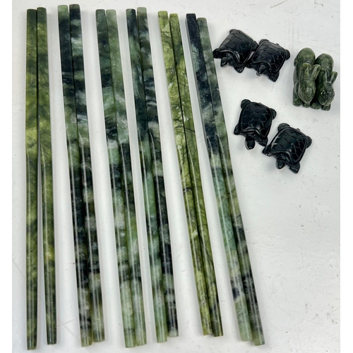 196 - A vintage collection of six pairs of green jade chopsticks with animal shaped rests. In original, Ch... 