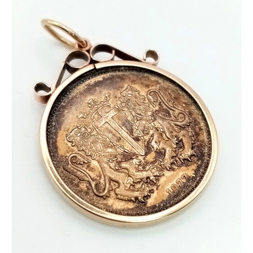 506 - A 1977 9K Yellow Gold St George Coin in a 9K Gold Setting. 4.58g total weight.