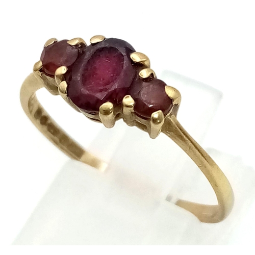 1019 - A Vintage 9K Yellow Gold Three Garnet Gemstone Ring. Size O. 1.76g total weight.