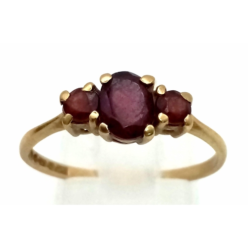 1019 - A Vintage 9K Yellow Gold Three Garnet Gemstone Ring. Size O. 1.76g total weight.