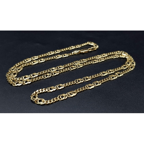 3 - An 18K Yellow Gold Flat Figaro Link Necklace. 58cm. 16.85g.