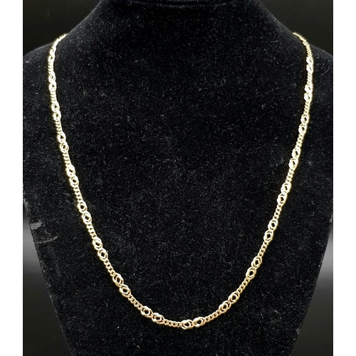 3 - An 18K Yellow Gold Flat Figaro Link Necklace. 58cm. 16.85g.