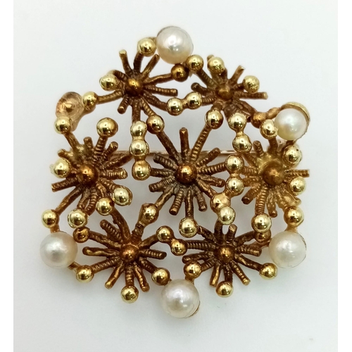 517 - An Antique 14k Yellow Gold and Seed Pearl Brooch. Autumnal floral design. 25mm diameter. 5.35g total... 