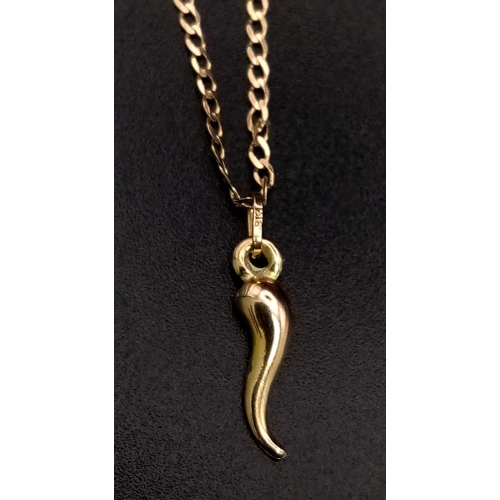 1035 - A 9K Yellow Gold Cornicello Horn Pendant on a 9K Yellow Gold Necklace. 15mm and 42cm. 1.53g total we... 