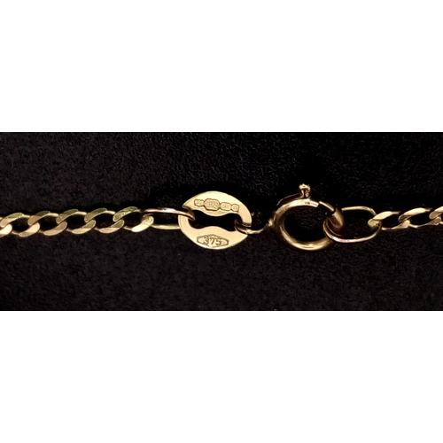 1035 - A 9K Yellow Gold Cornicello Horn Pendant on a 9K Yellow Gold Necklace. 15mm and 42cm. 1.53g total we... 