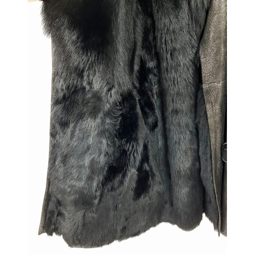 105 - A sophisticated and fashionable YVES SAINT LAURENT real fur lined, knee length, leather coat, crafte... 