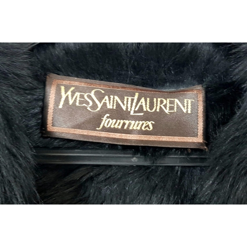 105 - A sophisticated and fashionable YVES SAINT LAURENT real fur lined, knee length, leather coat, crafte... 