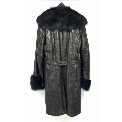 105 - A sophisticated and fashionable YVES SAINT LAURENT real fur lined, knee length, leather coat, crafte... 