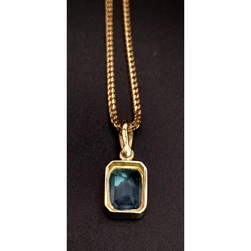 529 - A Blue Topaz Pendant set in 9K Gold on a 9K Gold Necklace. 
10mm and 50cm. 5.72g total weight.