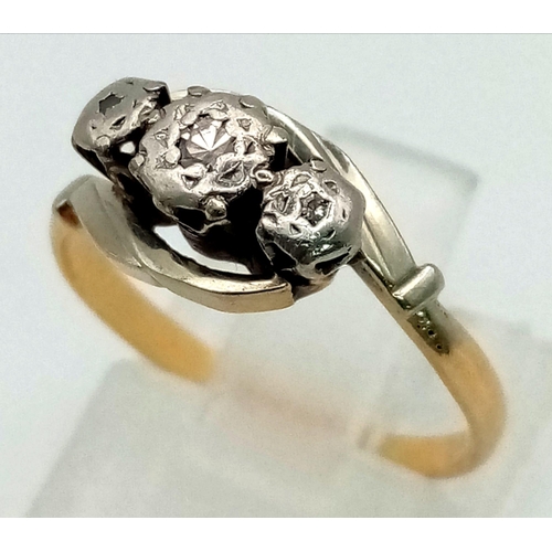 531 - An 18K Yellow Gold, Platinum Three Stone Diamond Ring. Size J 1/2. 2.45g total weight.