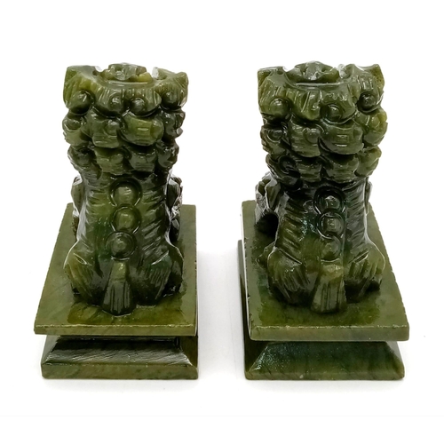 296 - A Pair of Miniature Jade Foo Dog Figures. 6.5cm tall.