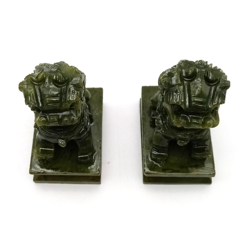 296 - A Pair of Miniature Jade Foo Dog Figures. 6.5cm tall.