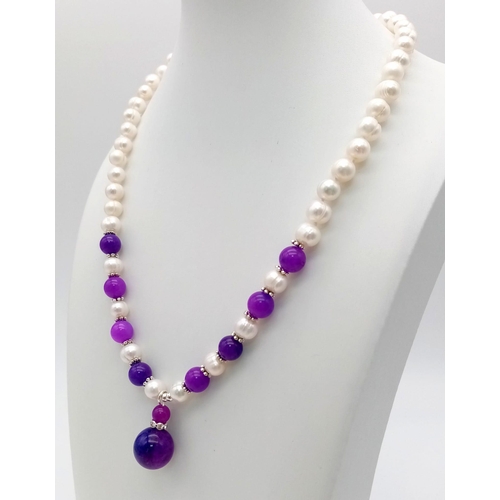 495 - An Akoya Pearl and Purple Sugalite Necklace and Pendant - 25mm. Necklace - 42cm