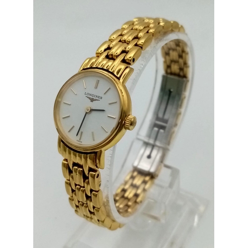 526 - A Gold Plated Ladies Longine Watch. Case -20mm. White dial with quartz movement. Needs a battery so ... 