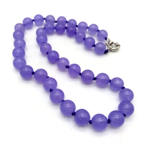 938 - A Purple Jade Bead Necklace. 10mm beads. 42cm.