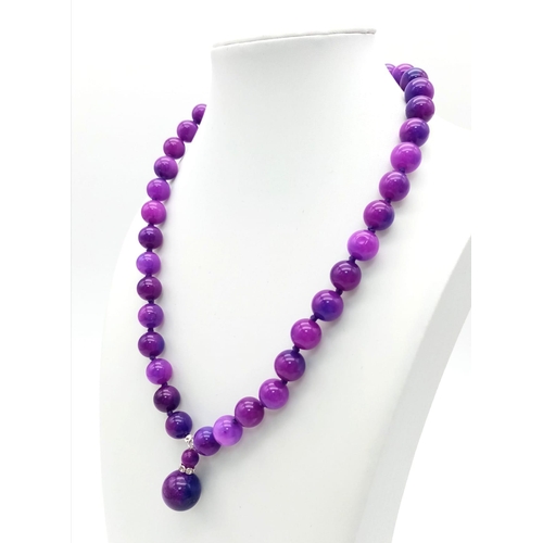 963 - A Purple Sugalite Stone Beaded Necklace and Pendant. 10mm beads and 12mm pendant bead. Necklace - 42... 